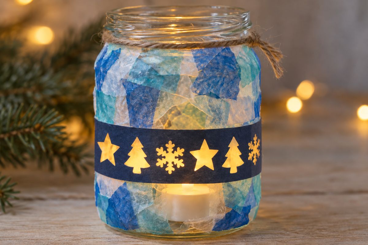 Weihnachtliches Windlicht aus Transparentpapier mit ausgestanzten Sternen, Tannenbäumen und Schneeflocken